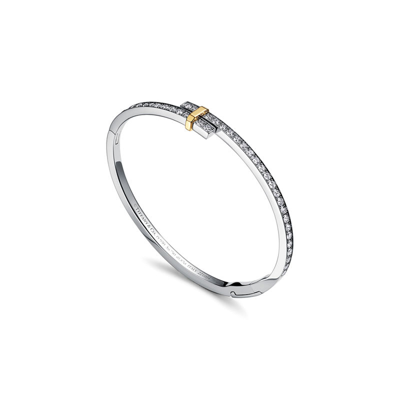 Tiffany & Co. Tiffany Edge Brazalete Hinged Bypass en platino y oro amarillo con diamantes Venta caliente