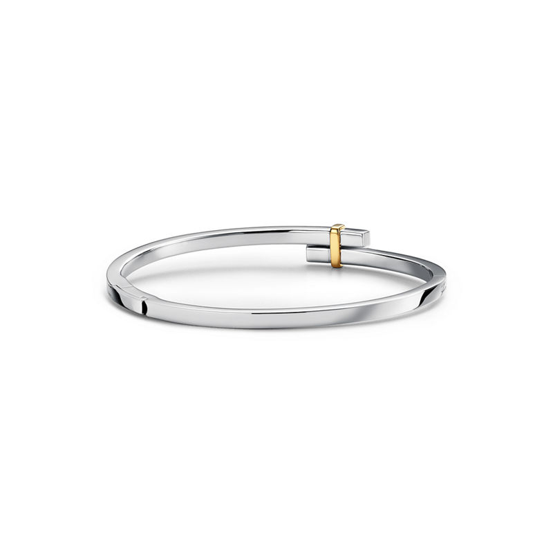 Tiffany & Co. Tiffany Edge Brazalete Hinged Bypass en platino y oro amarillo con diamantes Venta caliente